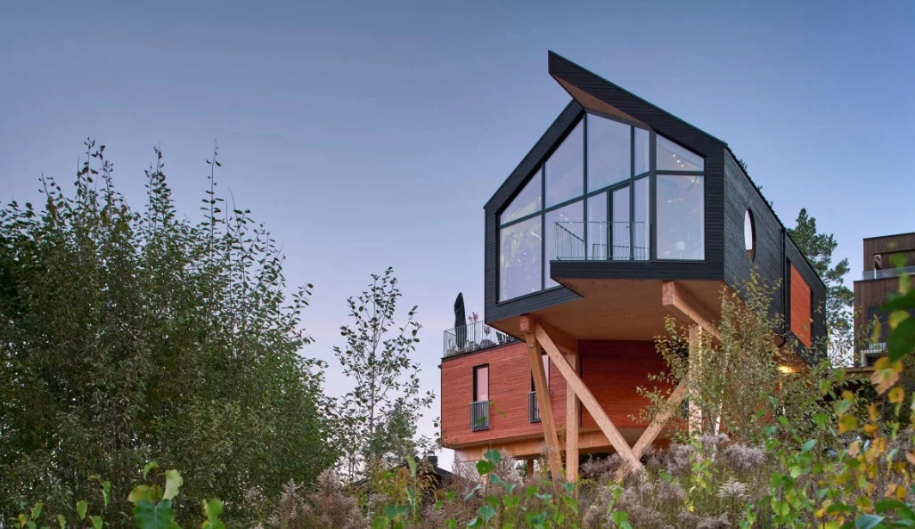 Large black-framed windows make the most of the magnificent surrounding views