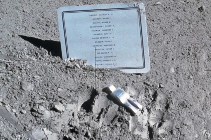 Photo of the Fallen Astronaut and accompanying name plaque left on the moon during the Apollo 15 mission