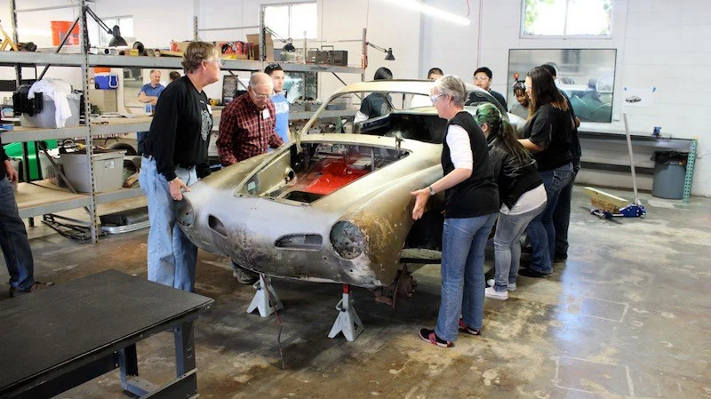 All hands needed to get the rusty Ghia ready for restoration and electric conversion