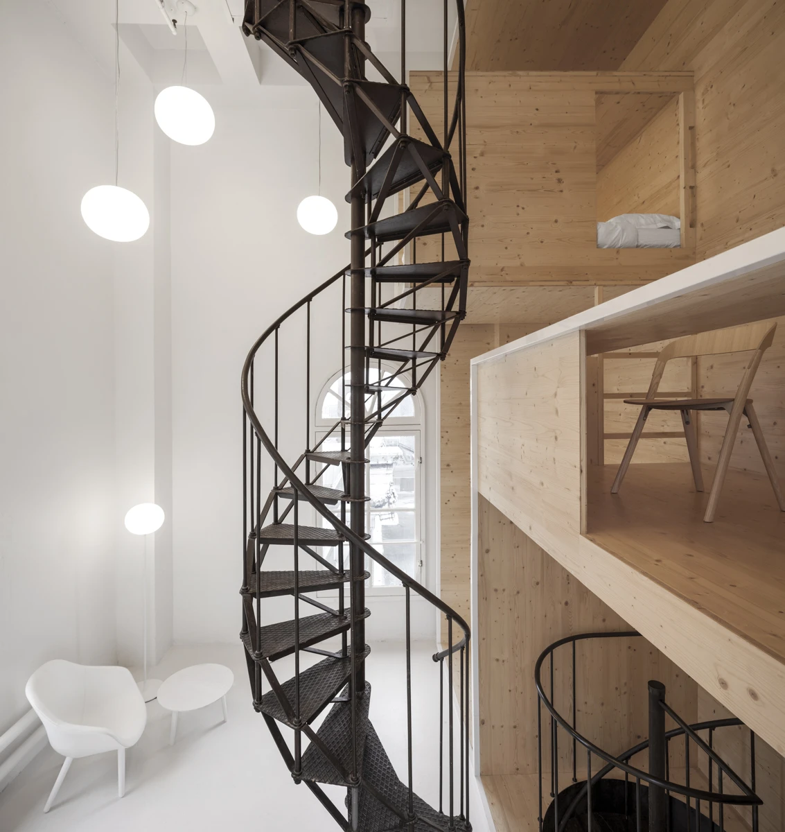 The wooden installation includes a pantry, working space, some storage, and a bed (for naps only – the artist will go home at the end of their working day) (Photo: i29)