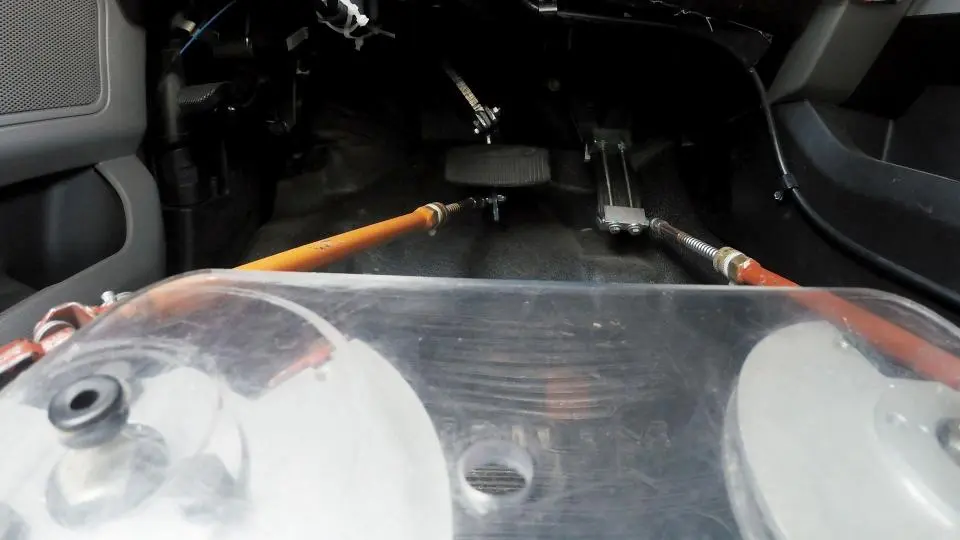 Actuators manipulate the throttle and brake pedals as a human would