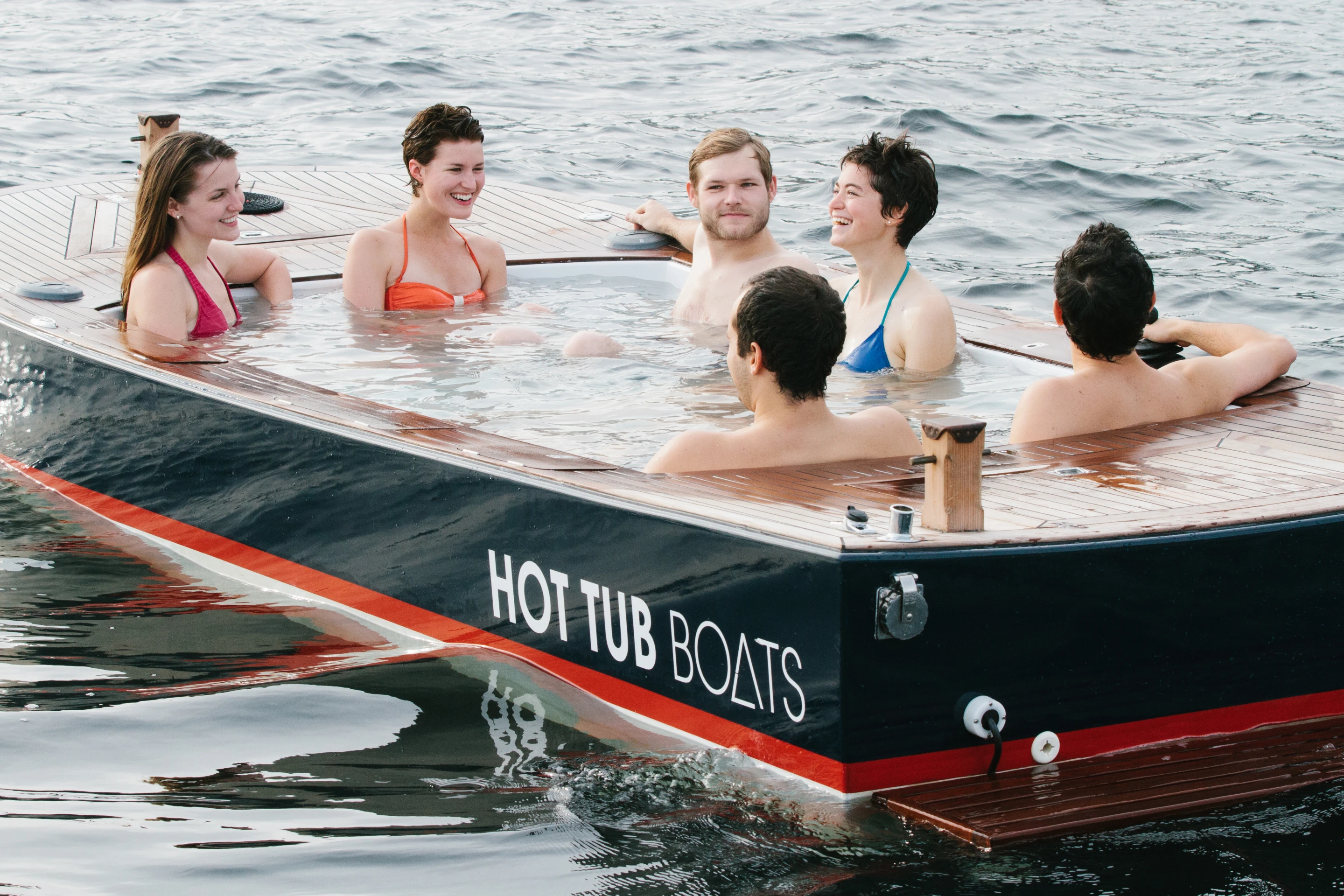 The Hot Tub Boat allows its passengers to soak while they cruise