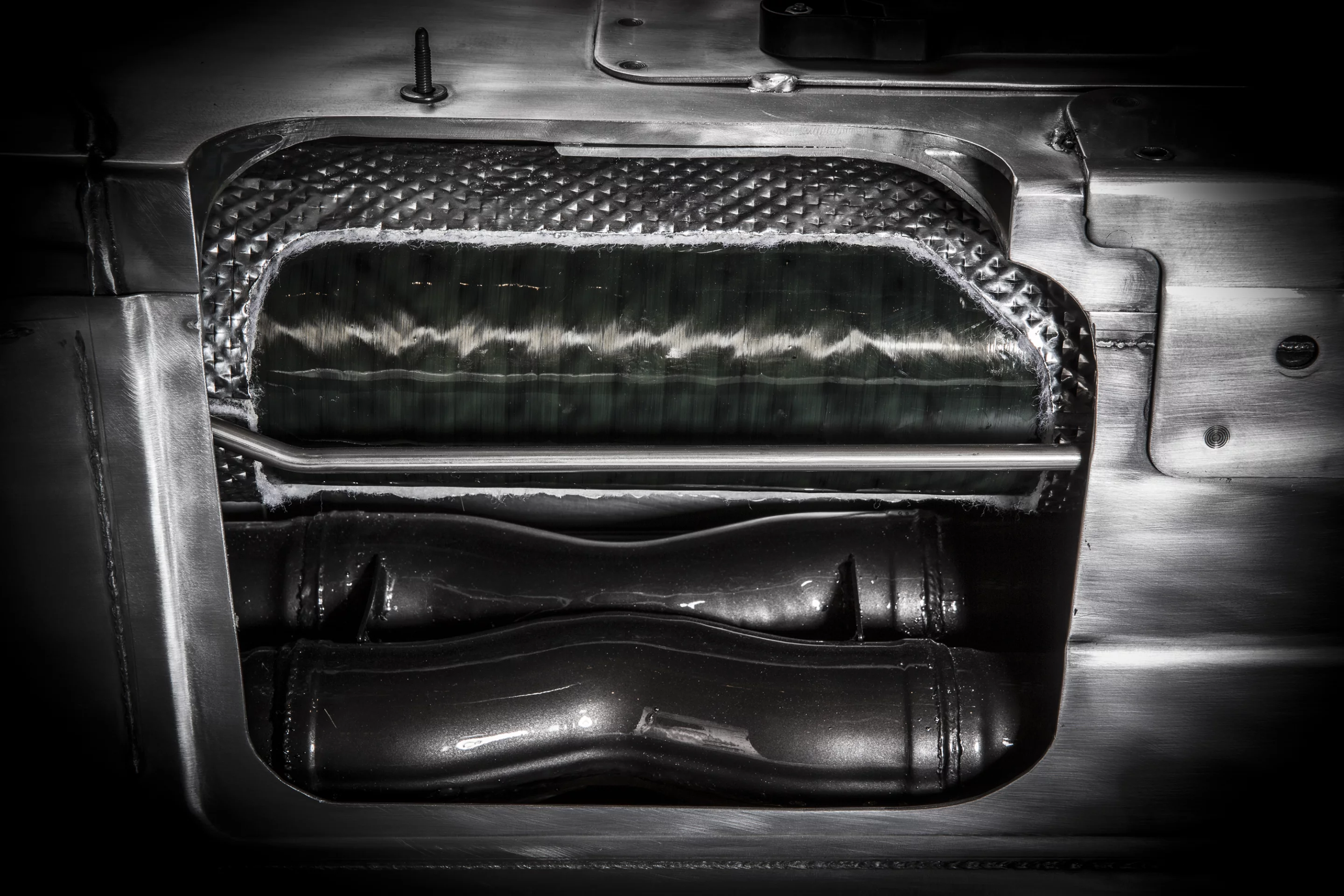 An Aussie sourced carbon fiber 6.5-ft long torque tube handles twisting forces between engine and differential