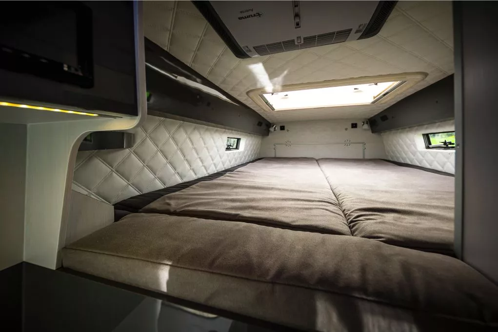 With a rear hinged wall panel to close it off, the Landyacht bedroom is more private than other vans that just position the rear bed right inside the van doors