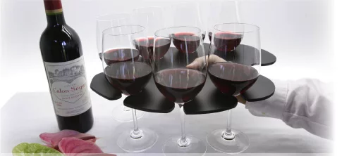 The Stem Glass Tray holds eight wine glasses in balanced formation and has a hole for your thumb