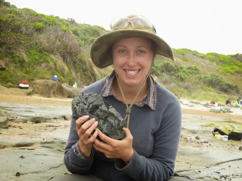 Volunteer Jessica Parker, with the elaphrosaur bone she discovered in 2015