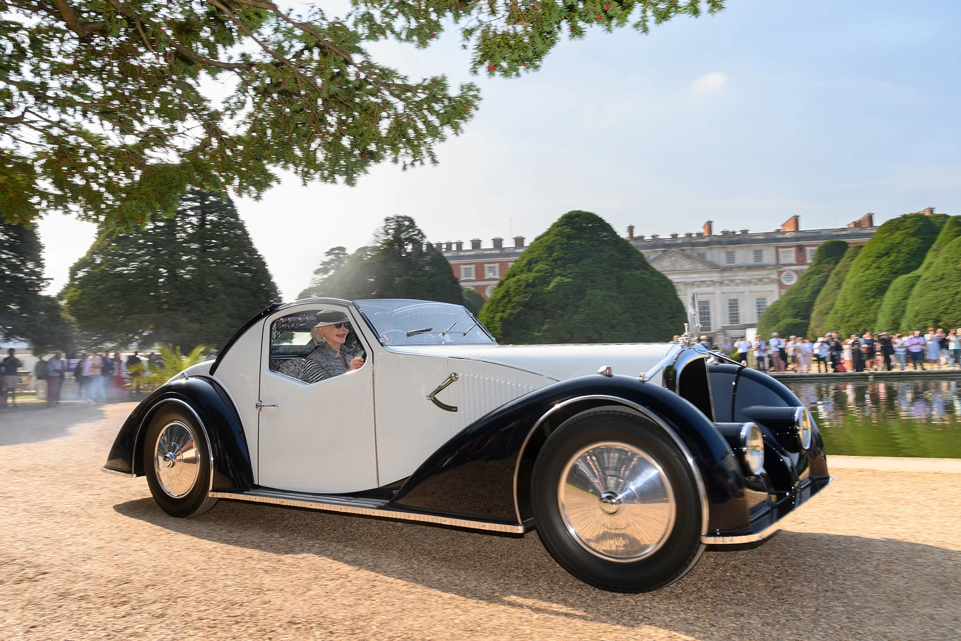 The 2021 Concours of Elegance presented by A. Lange & Söhne was held at Hampton Court Palace with the prestigious "Best in Show" award going to a unique art deco rolling sculpture known as the Voisin C-27 Aérosport of Merle and Peter Mullin. The Mullins have a collection of the finest French cars in the world including some priceless Bugattis, Citroens, Delahayes, Delages, and Peugeots. If you are in California, be sure to check out The Mullin Automotive Museum in Oxnard, California, US. Established in 2010, it displays over 100 vehicles from the collection