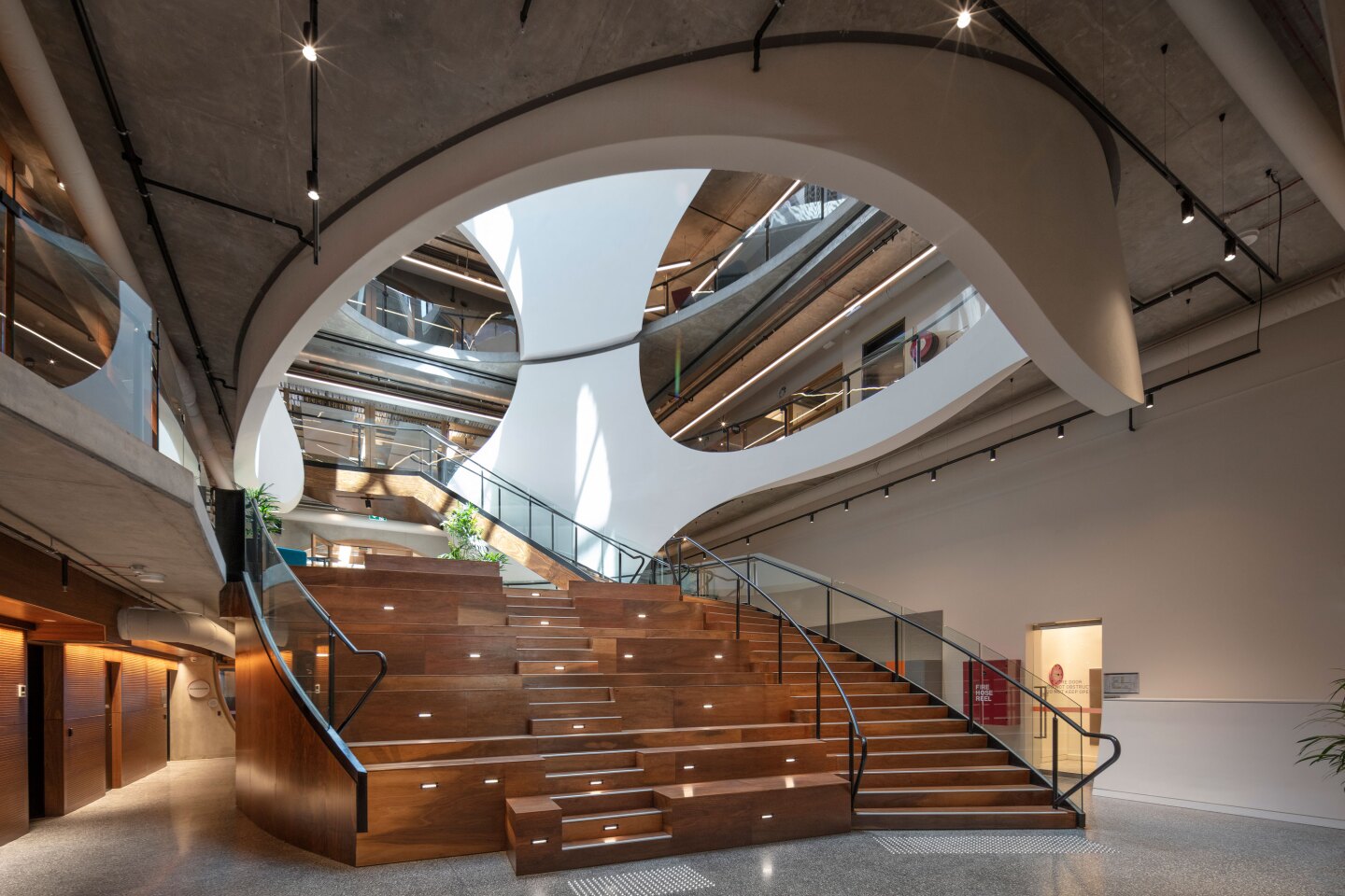 The Victorian Pride Centre's wooden staircase doubles as amphitheater-style seating