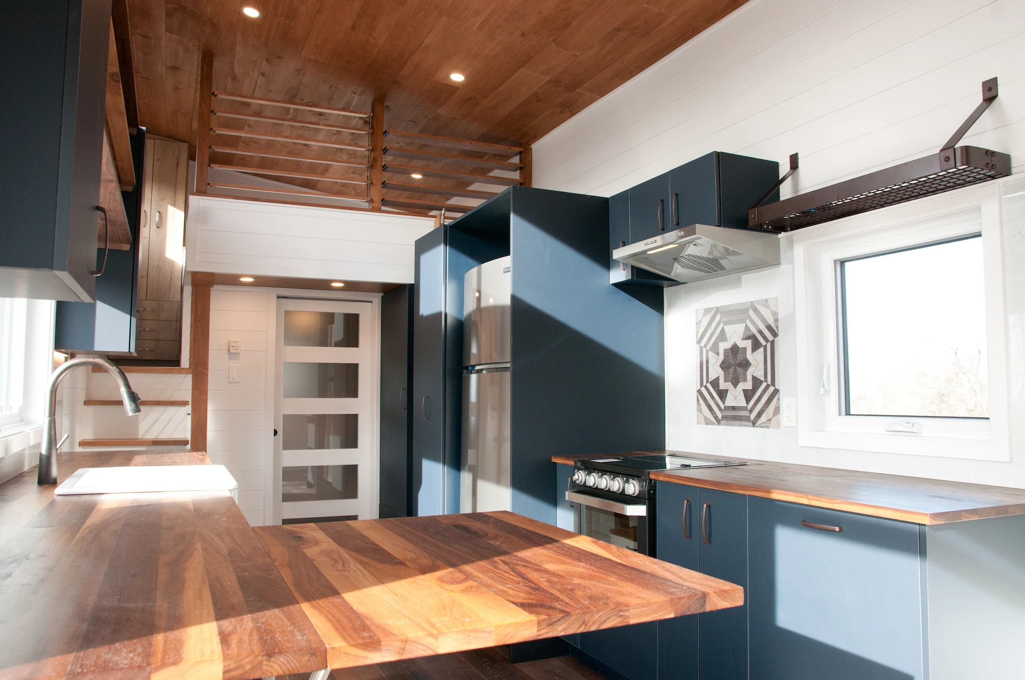 The Charme V2's kitchen includes a small dining area that folds away when not in use