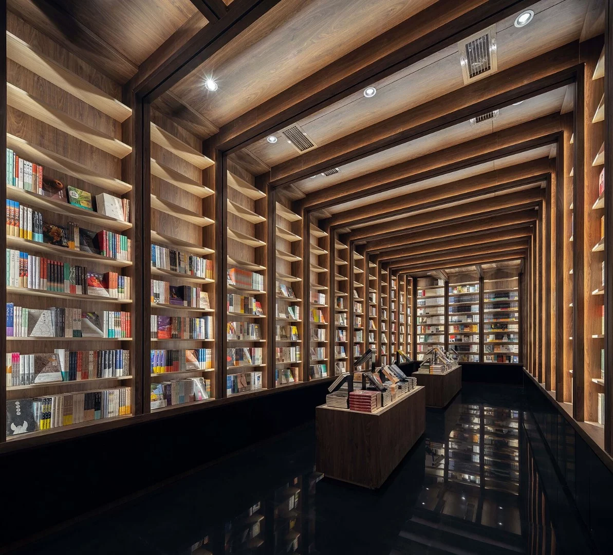 Tunnel with a reflective floor inside the Chongqing Zhongshuge Bookstore