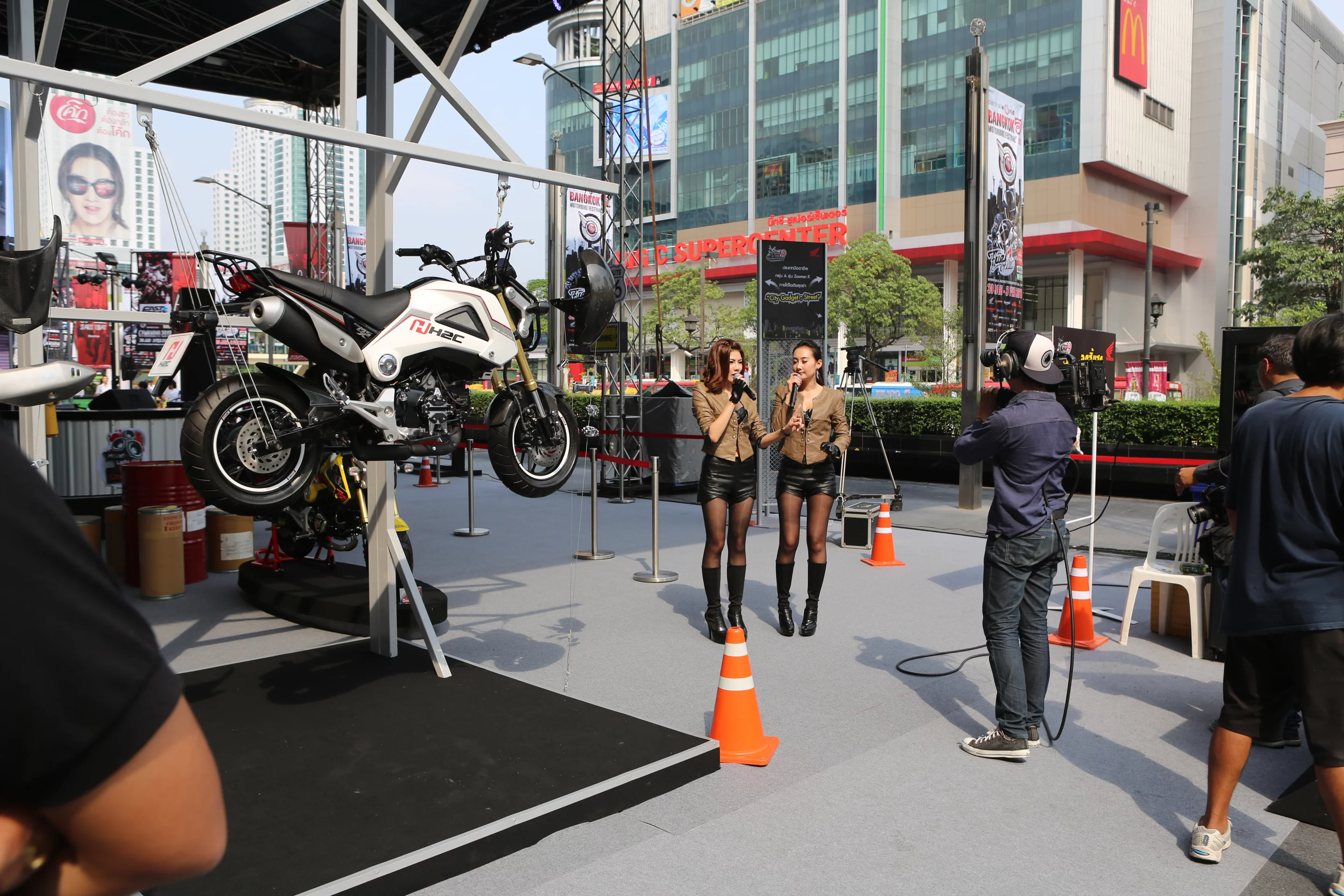 Honda's massive forecourt exhibition included a rolling televised presentation, here promoting the new roadgoing, fuel-injected MSX125 (Photo: Husna Namirembe/Gizmag)