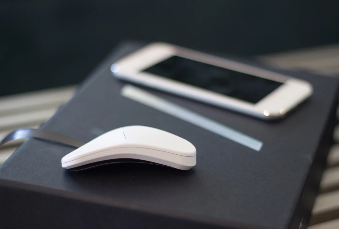 Thync device (foreground), with a paired iPod touch sitting behind it