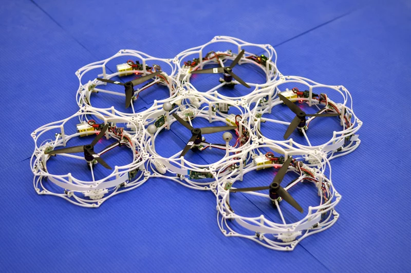 The sequence starts with an arbitrary group of robots on the ground