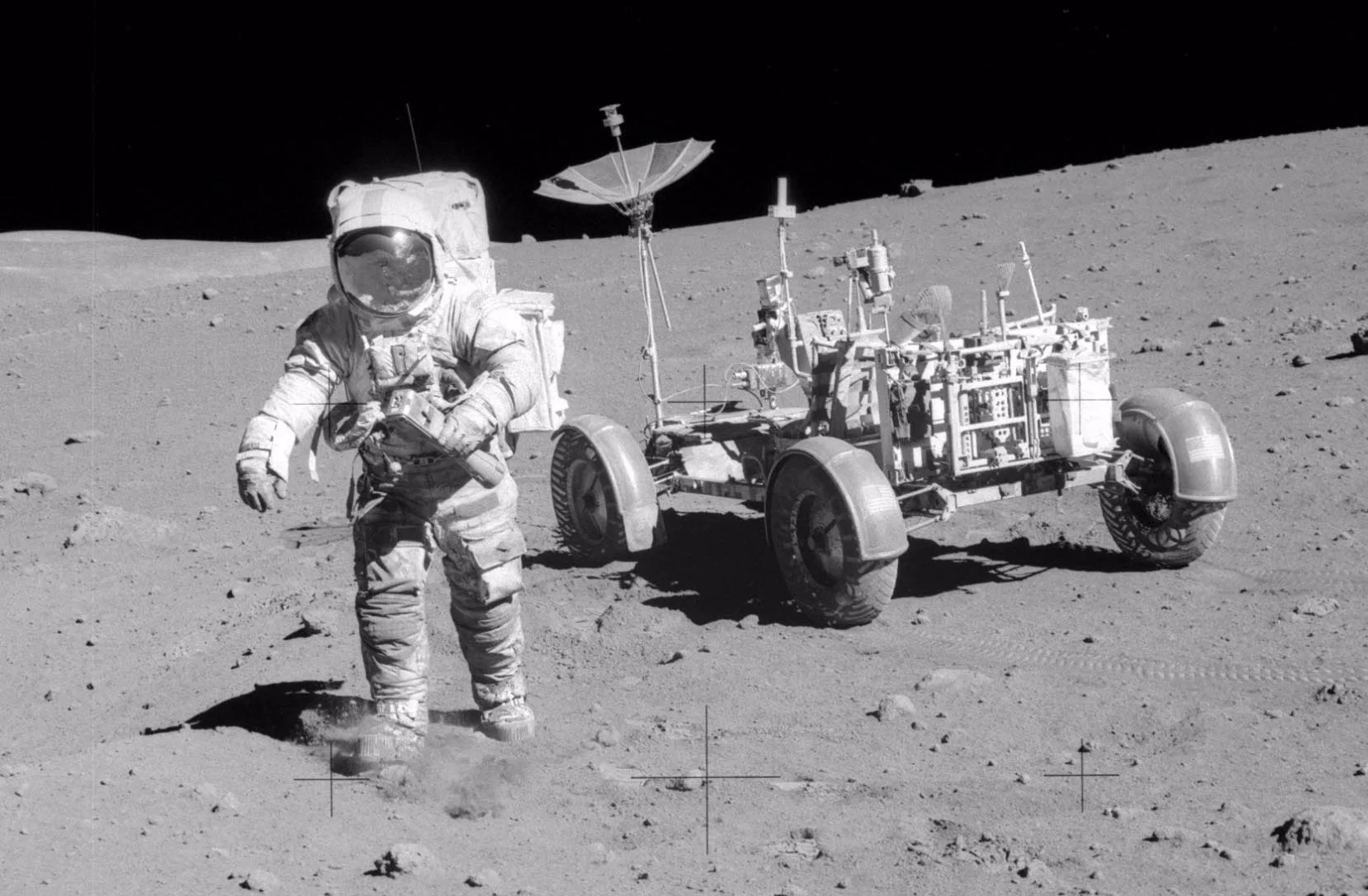 Colonel Scott with lunar rover and carrying camera with 500mm lens