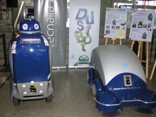 The DustCart is a humanoid robot for door-to-door garbage pickup, while the DustClean is meant for use in cleaning narrow town streets that traditional trucks can't access.