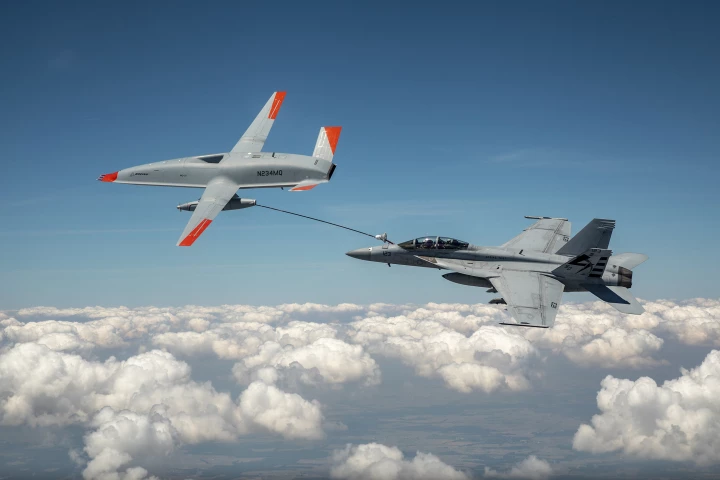 The MQ-25 T1 and the F/A-18 Super Hornet, connected via the drone's fuel hose