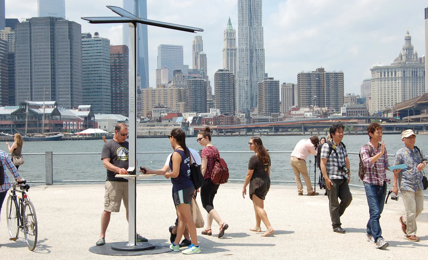 New Yorkers top up their smartphone batteries at a Street Charge station in New York