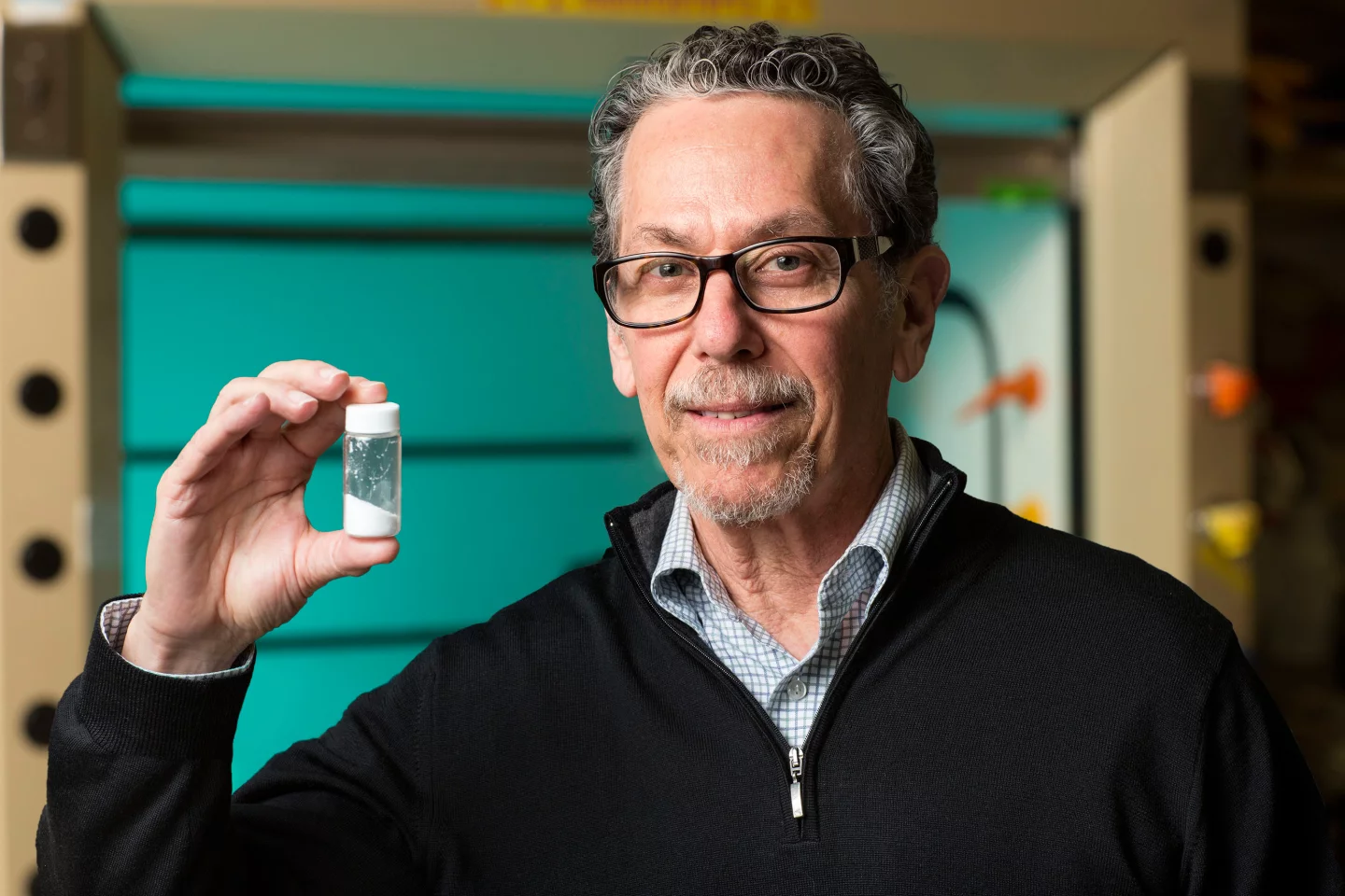 Prof. Evans with a vial of fexaramine (Photo: Salk Institute for Biological Studies)