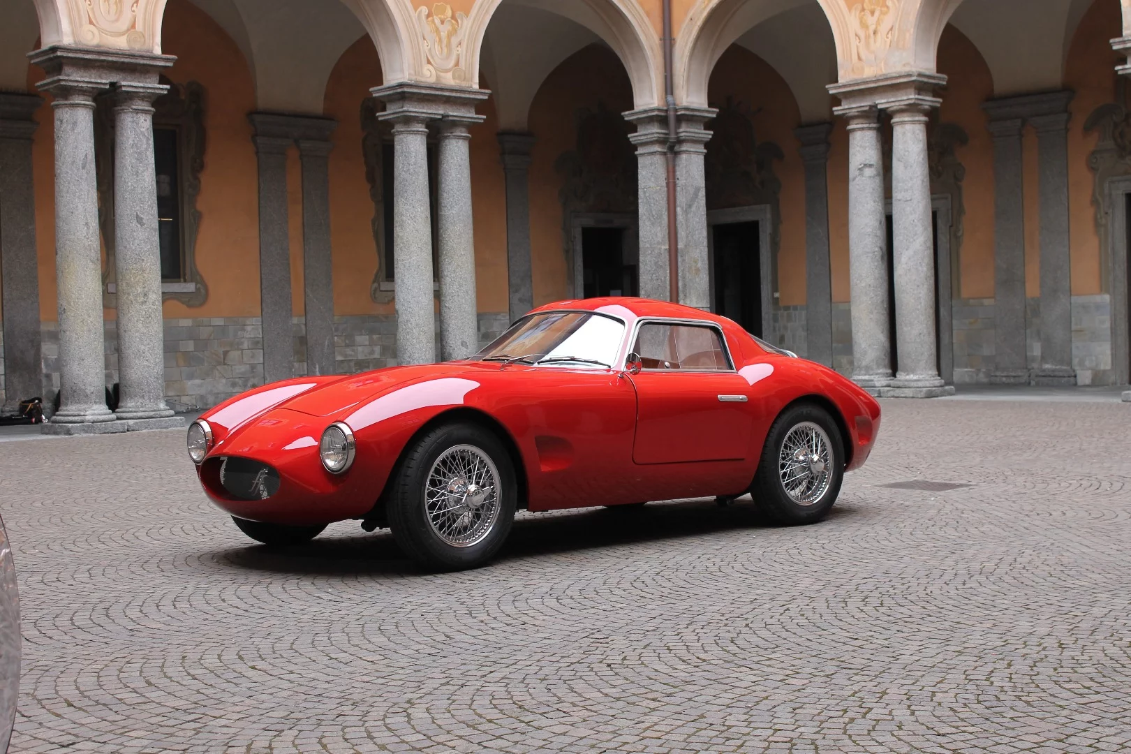 The new car rides on 15-in wire wheels