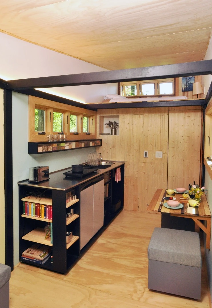 The kitchen features a low-flow faucet and plenty of worktop space