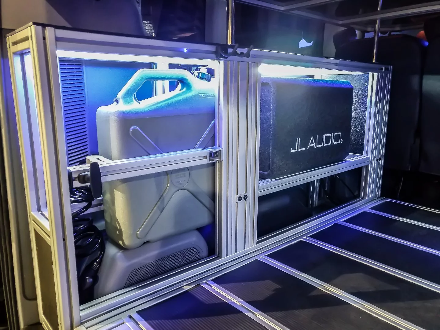 VanDoIt's T-track framed storage hardware holding water and audio equipment