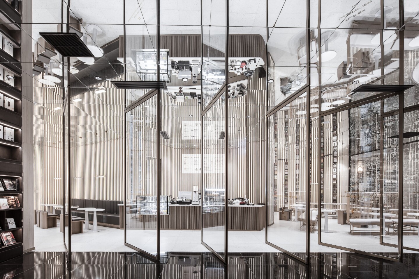 Glass doors open up to a cafe area inside the Zhongshuge bookstore in Ningbo, China
