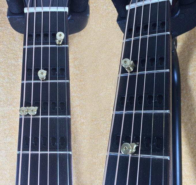The premium Gillis Capo Guitar features capo inserts in the neck up to the 9th fret, while the basic dreadnought goes up to 12