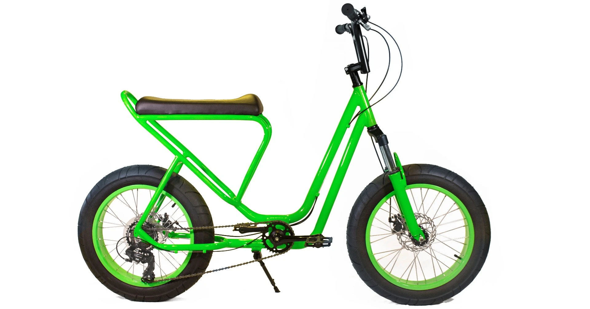 The Monkey Faction Capuchin's scooter-like features include a long padded seat, a 7000 series aluminum step-through frame, and a fully-upright feet-forward riding position