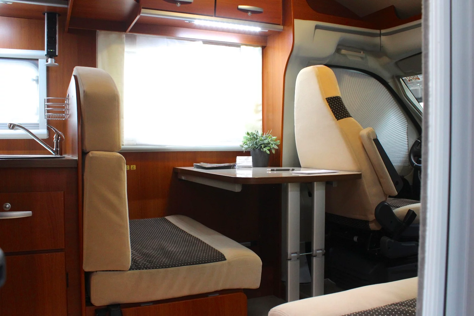 The Dog-Liner includes a dinette that converts over to the second bed area at night