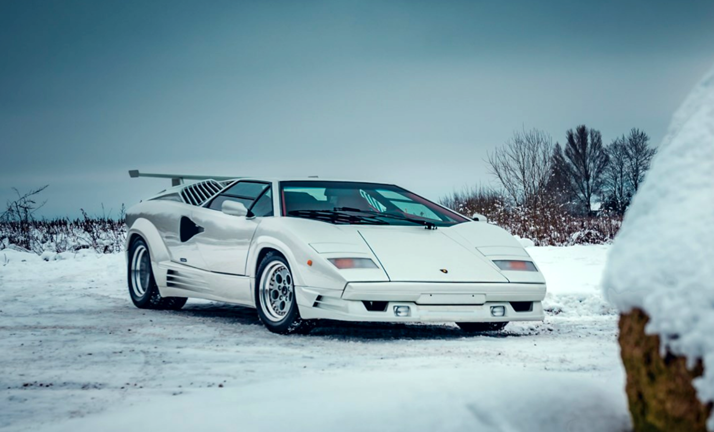 Best known these days for the cars bearing his own name, Horacio Pagani was tasked with updating the iconic Gandini-penned bodywork for the Lamborghini Countach's 25th Anniversary edition. The car was unveiled 1988 Grand Prix at Monza and although it retained the same visual panache and performance of the existing 5000QV, it boasted nearly 500 subtle updates intended to improve aesthetics and passenger comfort. Most importantly, the Countach’s relatively spartan appointments were upgraded to include all-new power windows, power seats and a more powerful air conditioning system capable of coping with all that glass in a warm climate. A sign of the rarified atmosphere encountered by truly collectible cars is this car's total of just 3,465 km since it was new. It sold for $406,835 (€331,250) | Auction Description | Estimate: € 250,000 to € 300,000