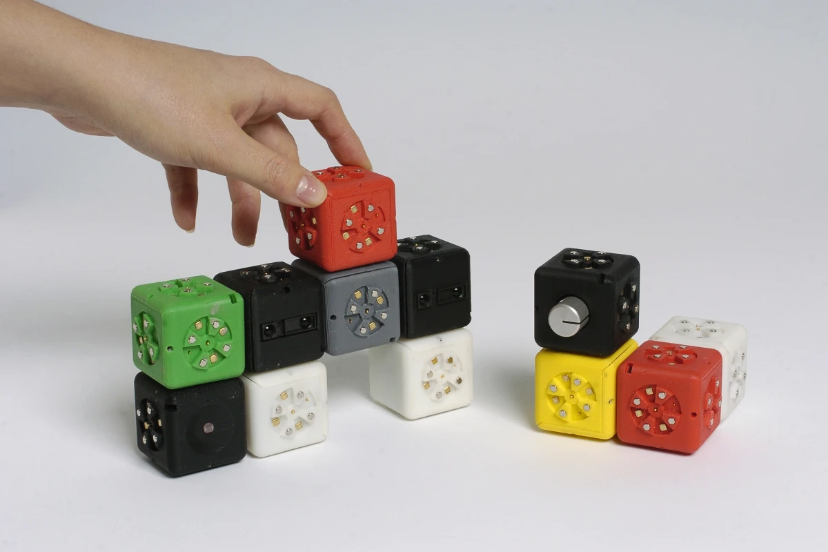 The Cubelets robotic construction kit allows anyone to build simple robots using blocks that magnetically snap together, the overall behavior determined by the interaction between them
