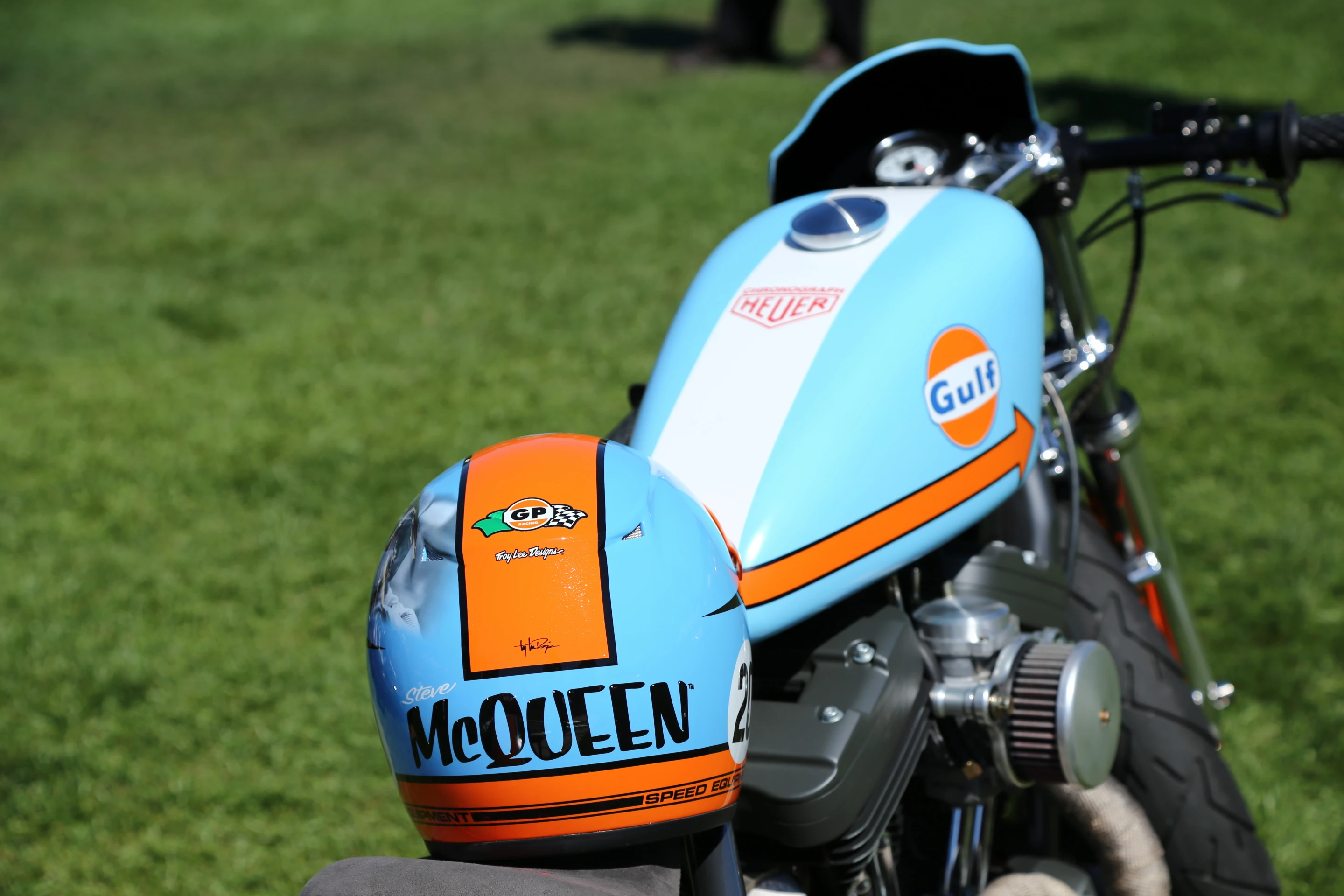 A Steve McQueen bike decked out in Gulf orange and blue racing colors in the vintage section at Quail (Photo: Angus MacKenzie/Gizmag.com)