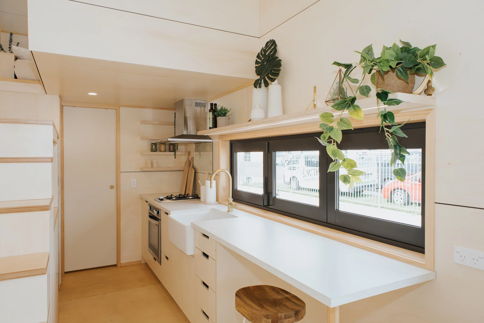 The Hilltop Tiny House's kitchen includes a breakfast bar for two