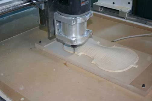 Photograph of the CNC machine carving the back of the Stradivari Betts violin reproduction. (Photo: RSNA)