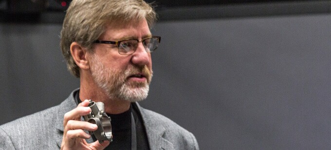 Dennis Little, vice president of Production, shows a 3D-printed part