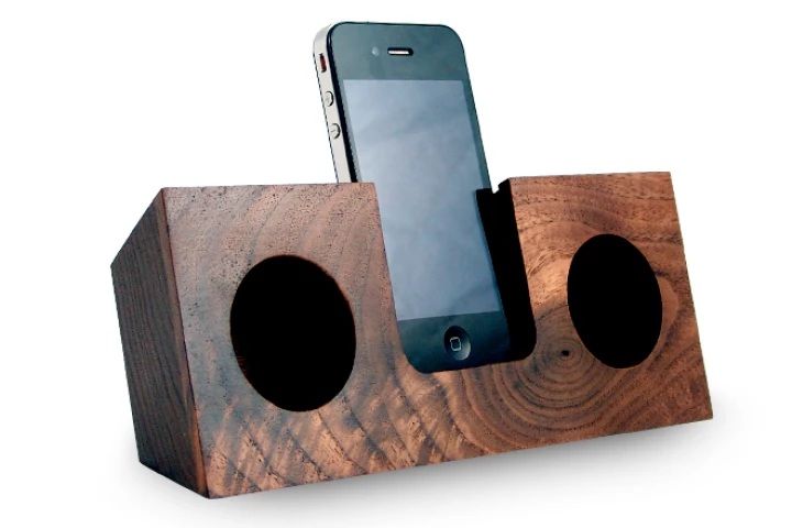The Koostik iPhone dock utilizes the smartphone's own speakers, and channels the audio into hollowed out, hemispherical sound chambers where the sound is amplified by up to four times