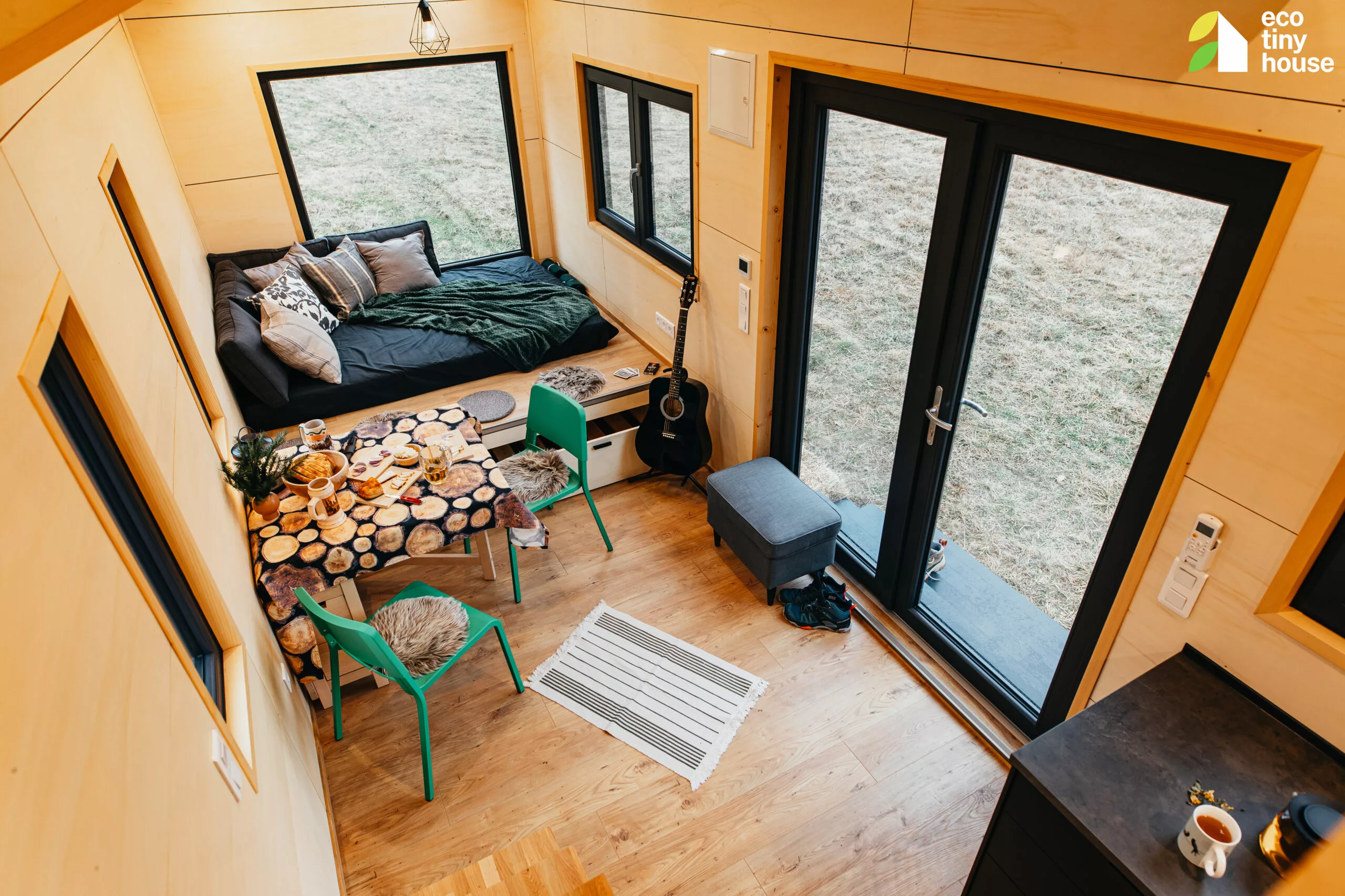 The Tiny Hogwarts' interior is finished in wood and looks light-filled thanks to its generous glazing