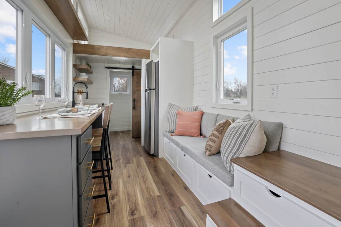 Ulla-Carin's living area is very compact but looks bright thanks to the large windows