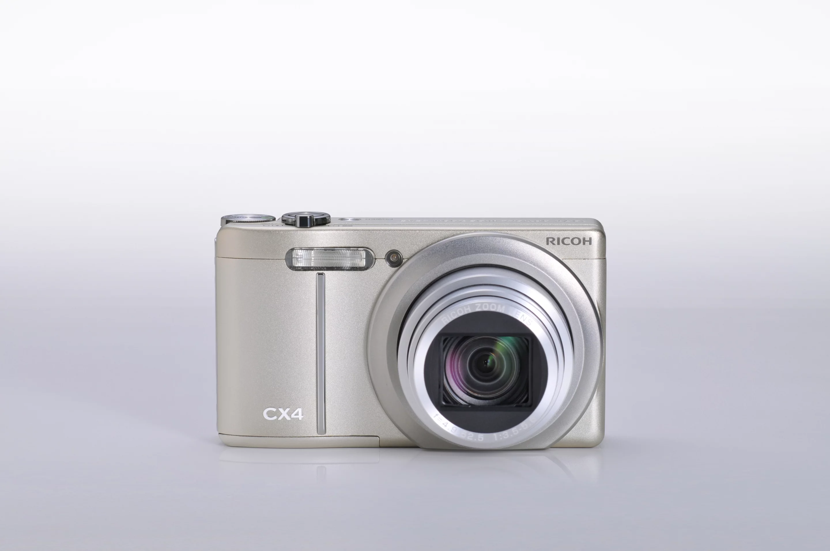 The Champagne silver CX4 from the front, lens open