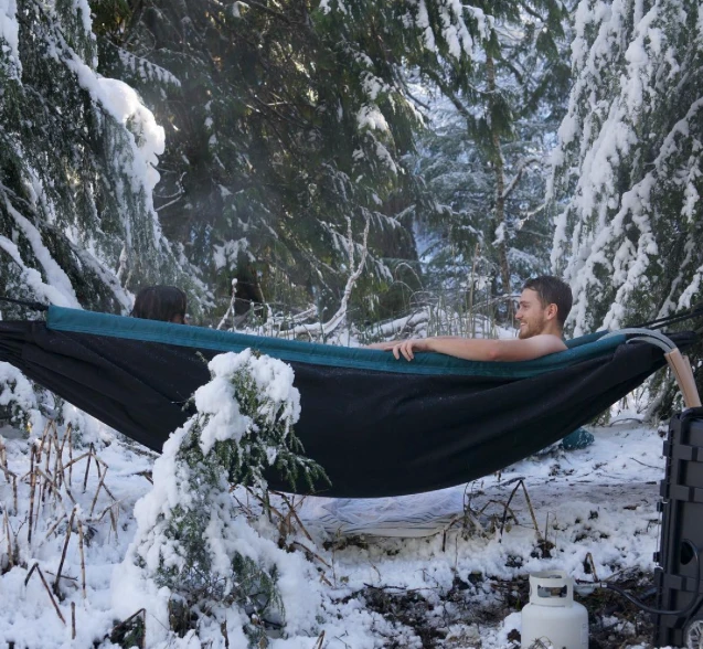 Enjoying the propane-heated hot water in the Hydro Hammock