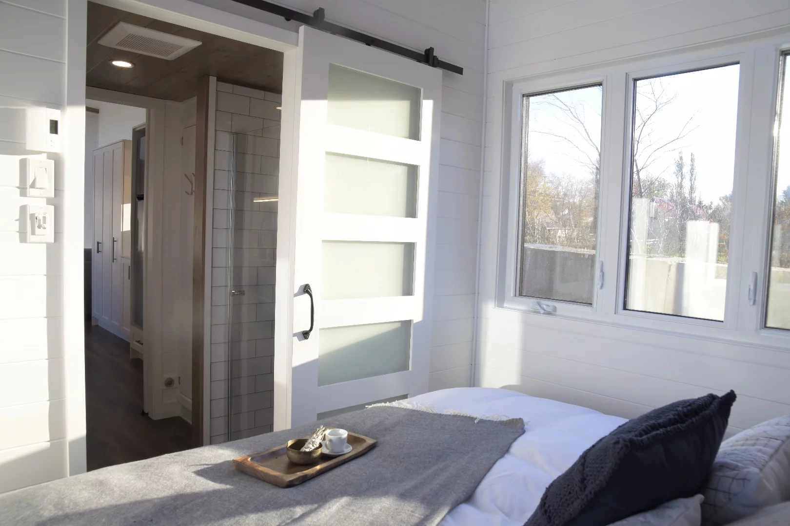 The Magnolia's main bedroom is accessed by sliding door