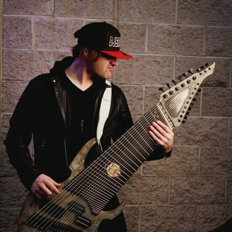 The Djent 2018 guitar has 18 strings, three pickups and a body face fashioned from real stone