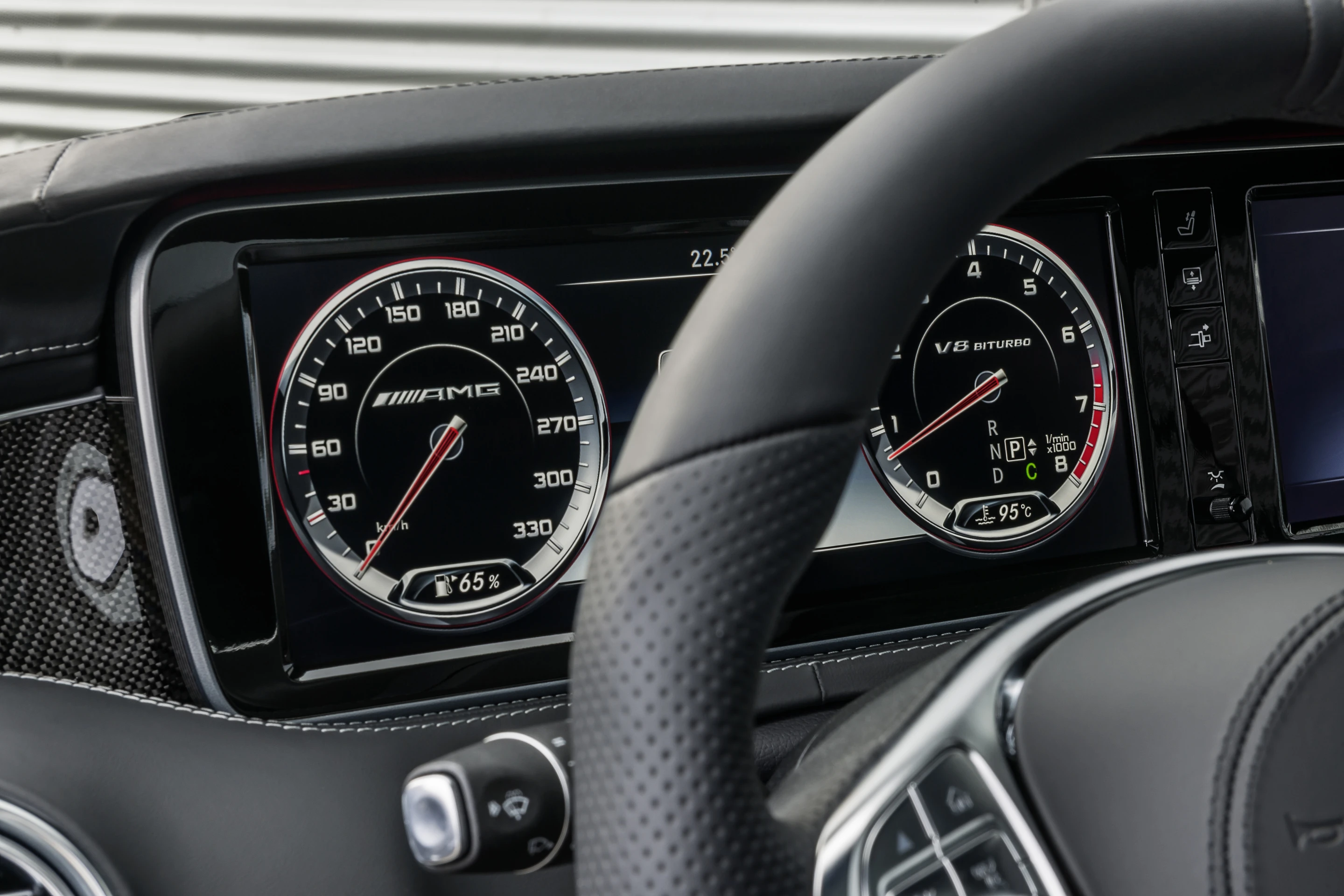 A custom 3-spoke AMG steering wheel is standard fare in the new S63 AMG Coupé