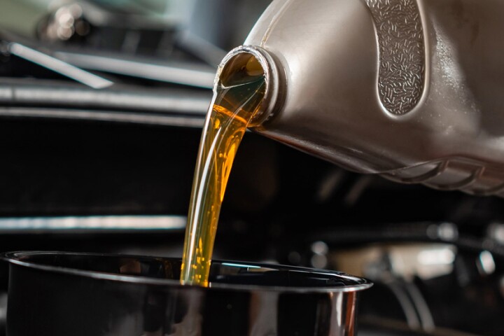 Pouring motor oil into an engine