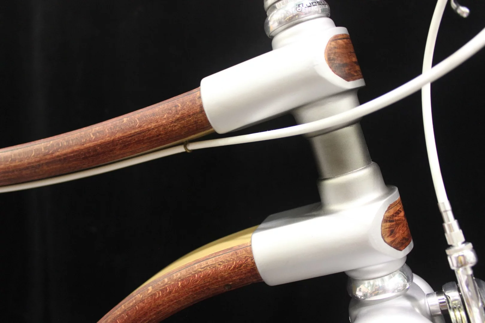 Front end details on Atelier Kinipio's wooden bike