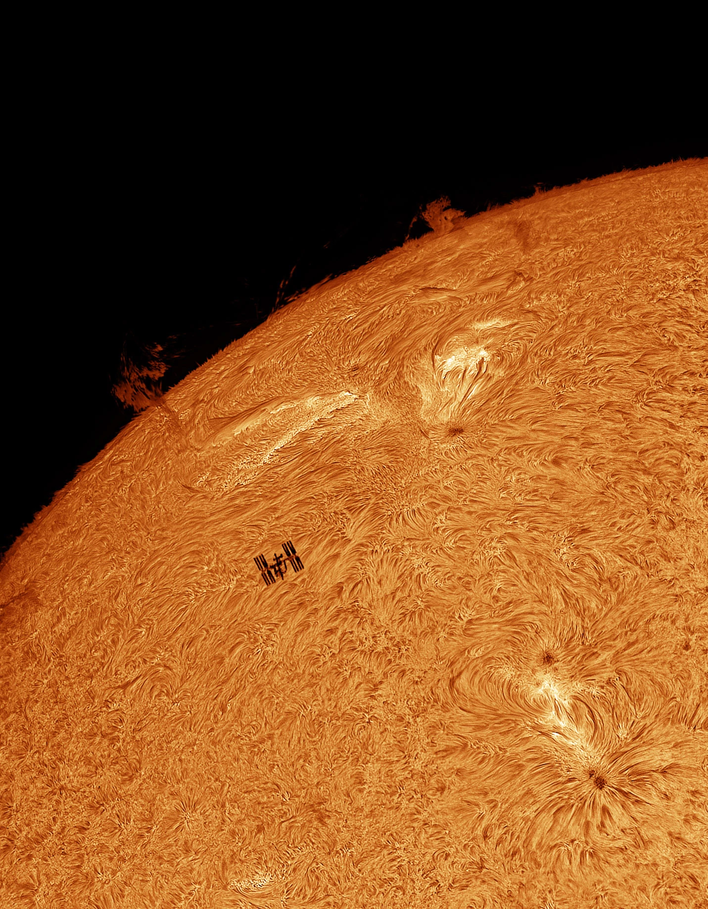 People & Space Winner: High-Tech Silhouette © Tom Williams (UK). The International Space Station transits in front of the Sun.