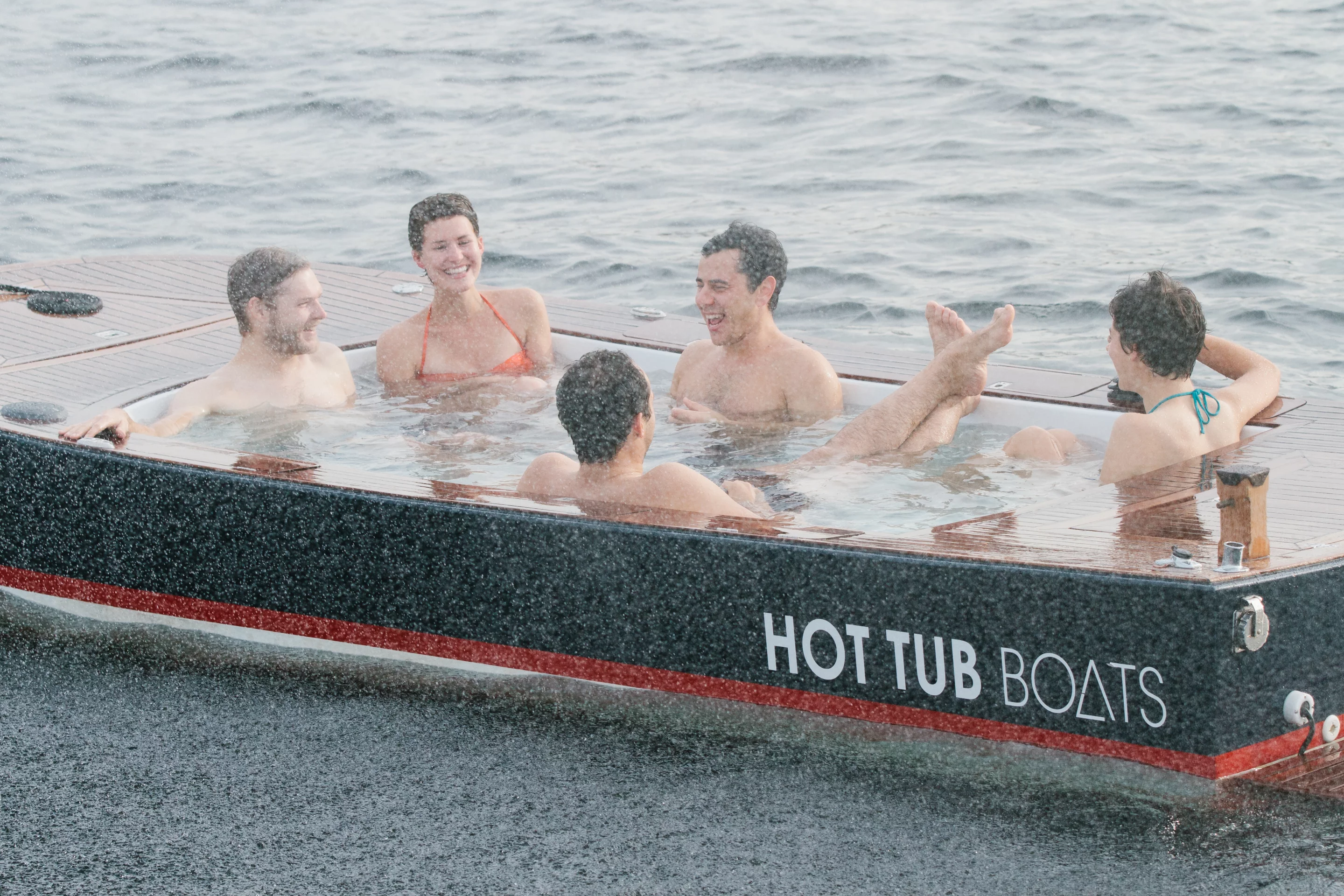 The Hot Tub Boat allows its passengers to soak while they cruise