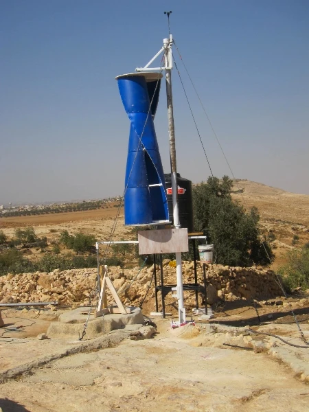 The turbine structure is made from recycled plastic barrels and connected to the cistern