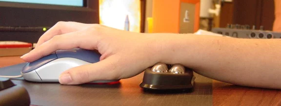 The Ergoroller computer wrist support massages your wrist as you use it