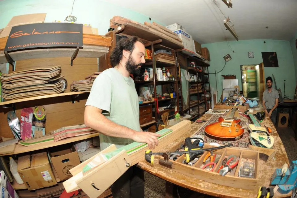 Galasso working on the neck for a new Skate Guitar